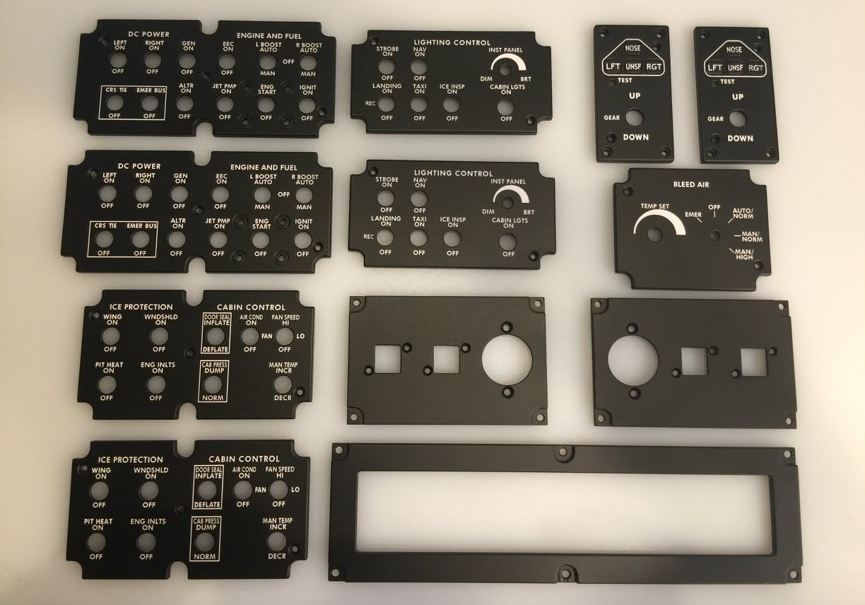 Assorted sets of aircraft cockpit back-lit control panels