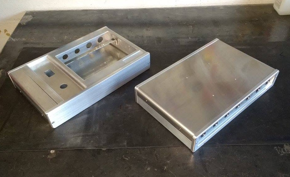 Control panel for an industrial laser-marking machine, fabricated from sheet metal and machined parts